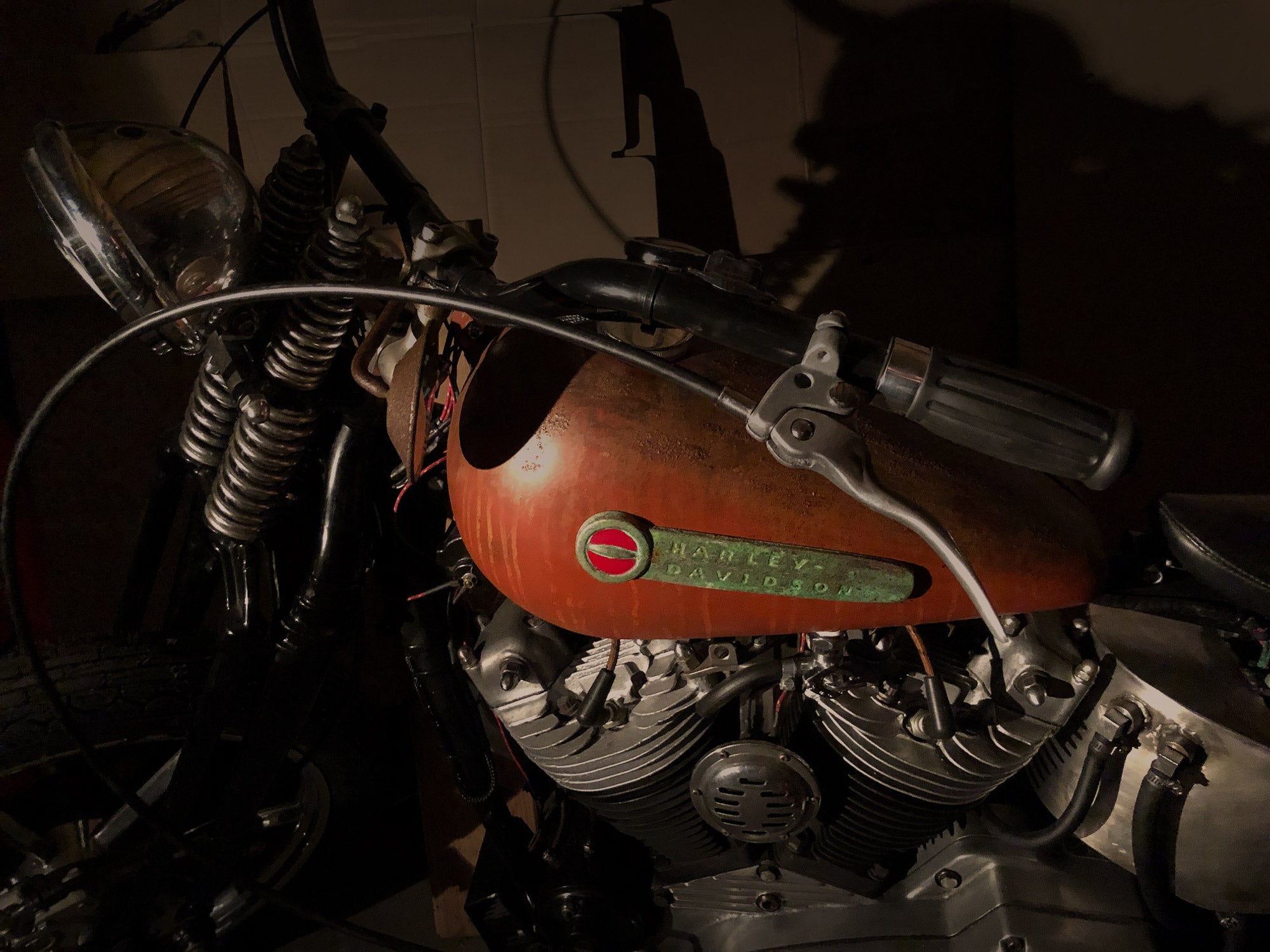 Bobber style handlebars, springer front end and narrow split tanks.